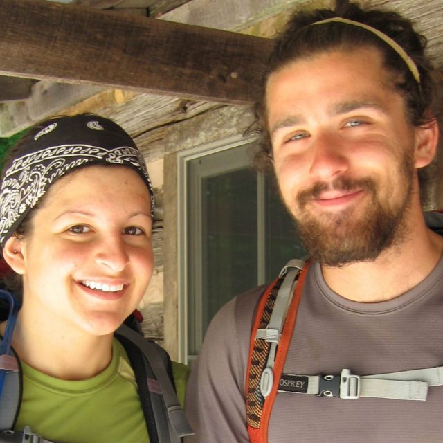 2-Hikers-Smiling-with-Back-Packs